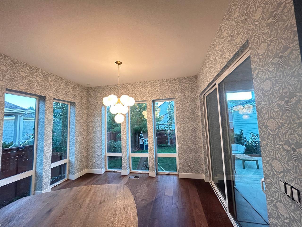 Neutral tone wallpaper installed in a residential hallway