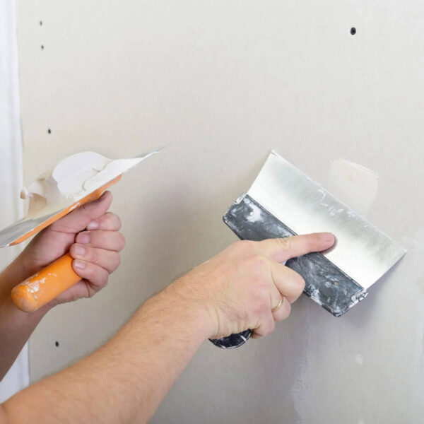 Commercial wallpaper installer working in Colorado office space