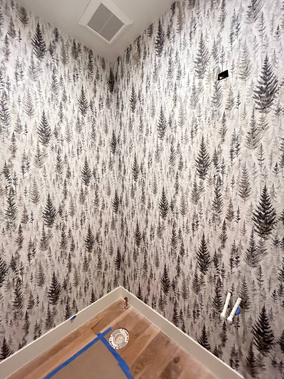 Contemporary wallpaper installed cleanly on accent wall
