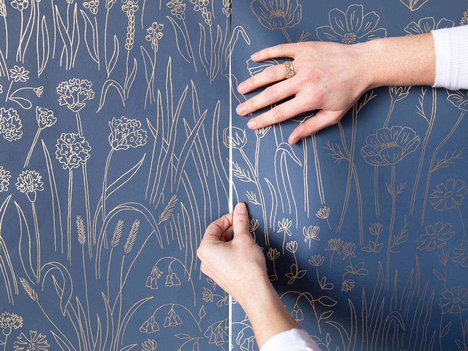Commercial wallpaper installer working in Colorado office space