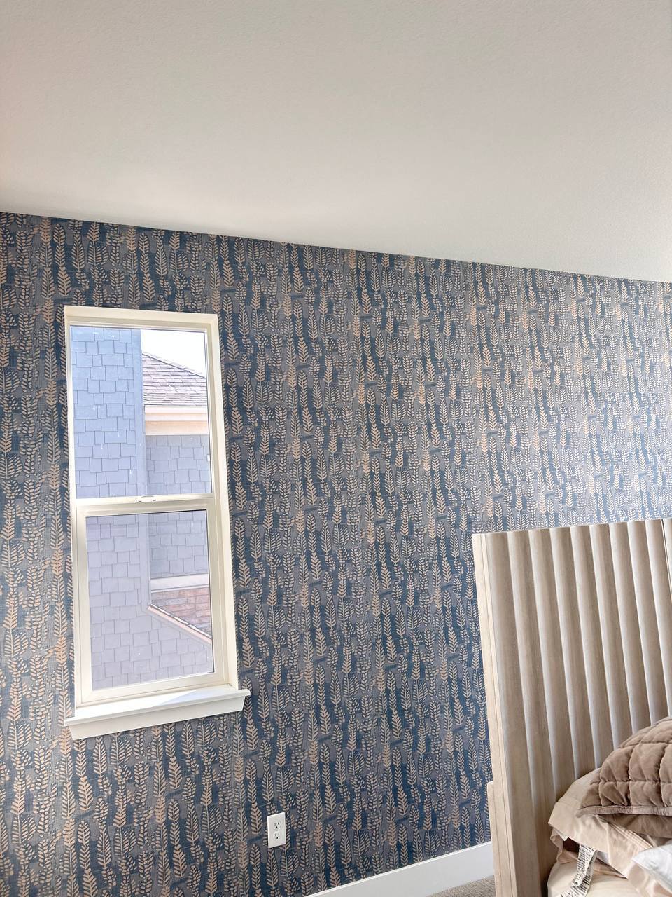 Wallpaper installation showcasing detailed classic patterns