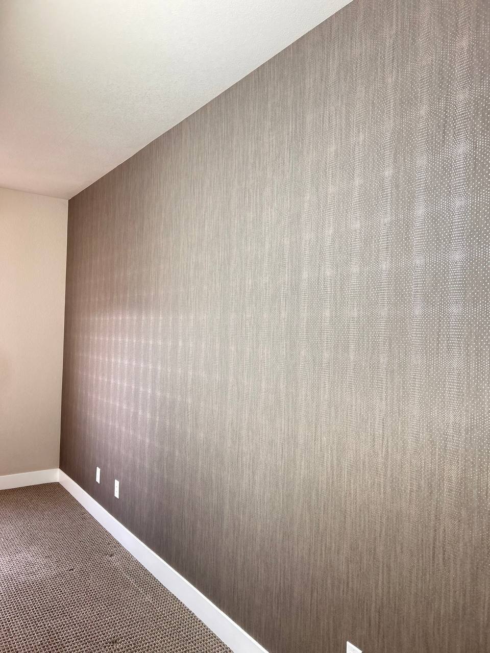 Finished wallpaper installation with patterned feature wall
