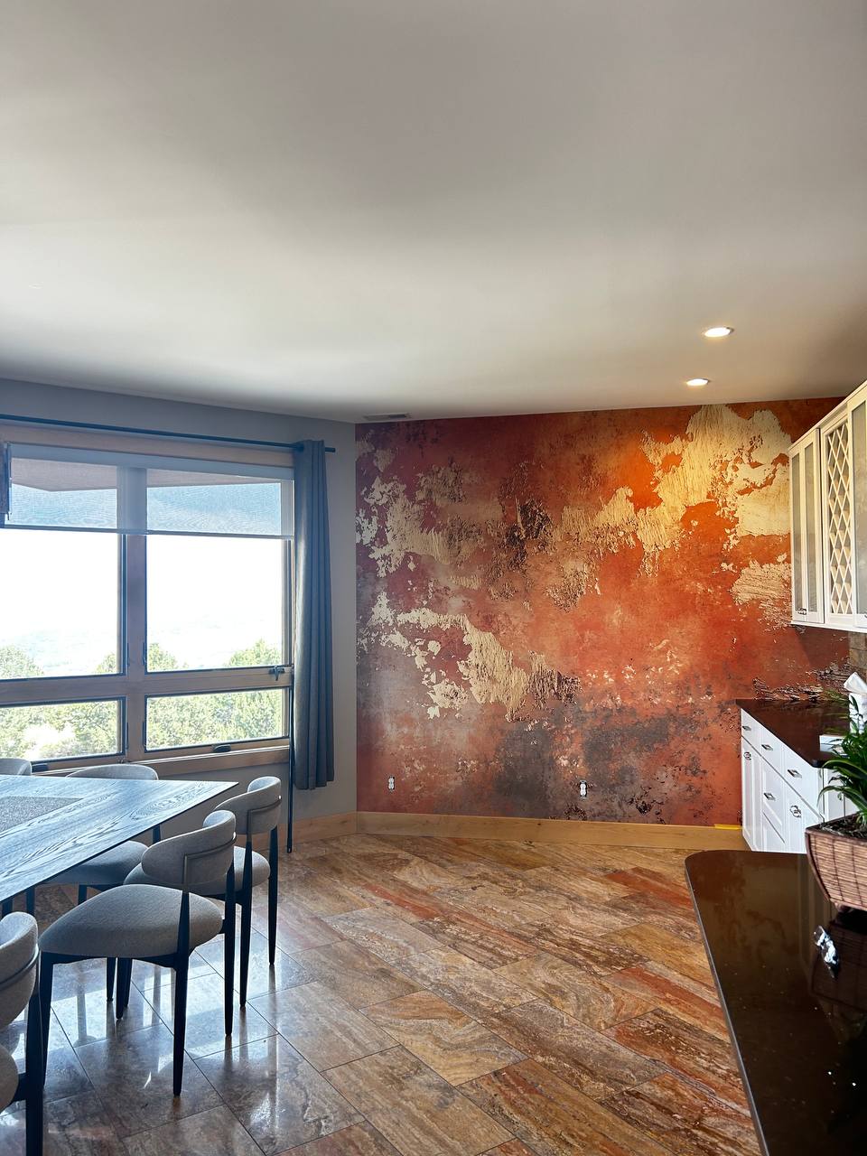 Modern office lounge area featuring sleek white walls and marble flooring, prepared for high-quality wallpaper installation.